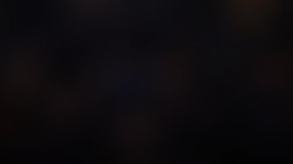 Speaker confidently using body language on stage, connecting with an audience